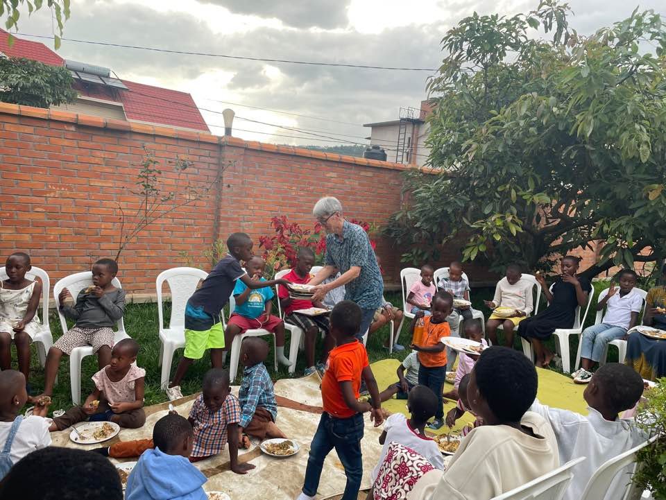 UAIT faculty serving meals to children during Christmas celebration