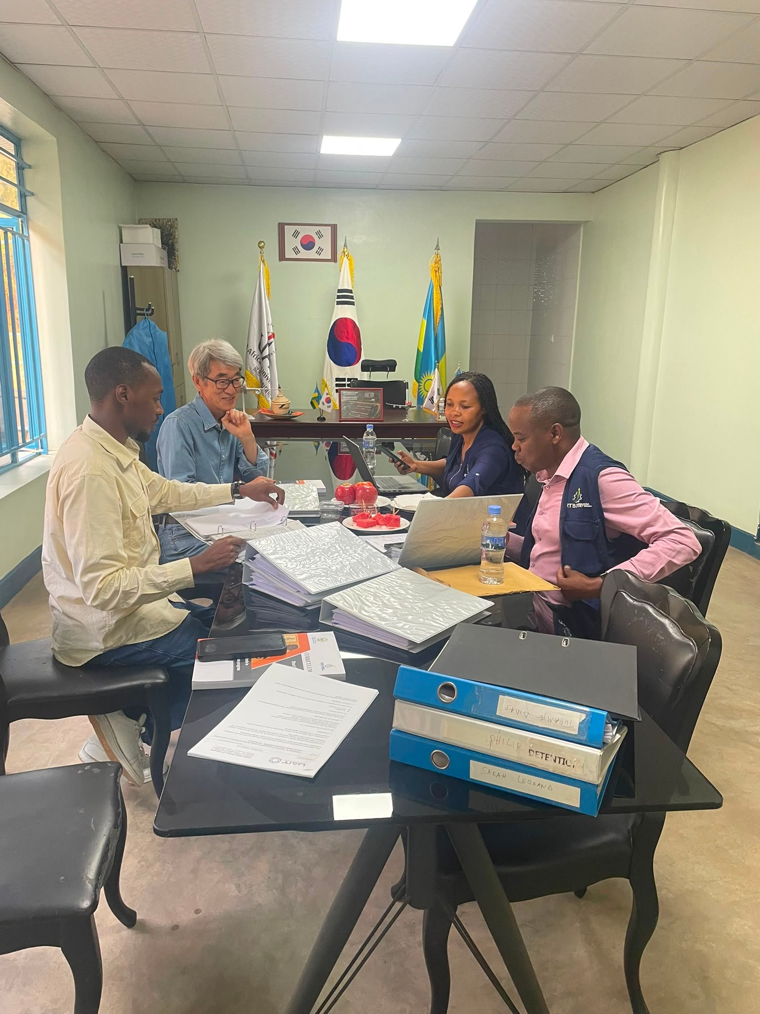 RTB verification team and UAIT staff seated at a table reviewing student portfolios and programme documentation
