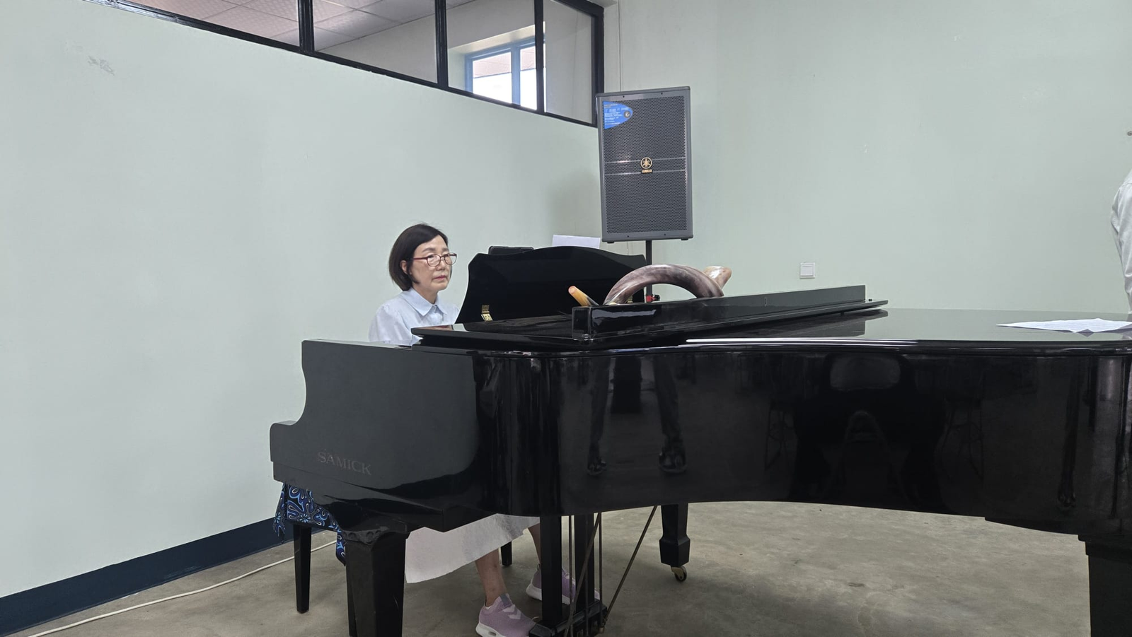 Pianist accompanying worship at the UAIT Friday Chapel